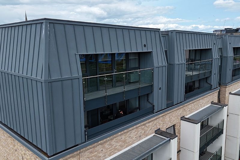 Roofers close to me installed Vieo standing seam zinc wall cladding, commercial cladding by KingCraft roofing & cladding specialists Leeds, Yorkshire.