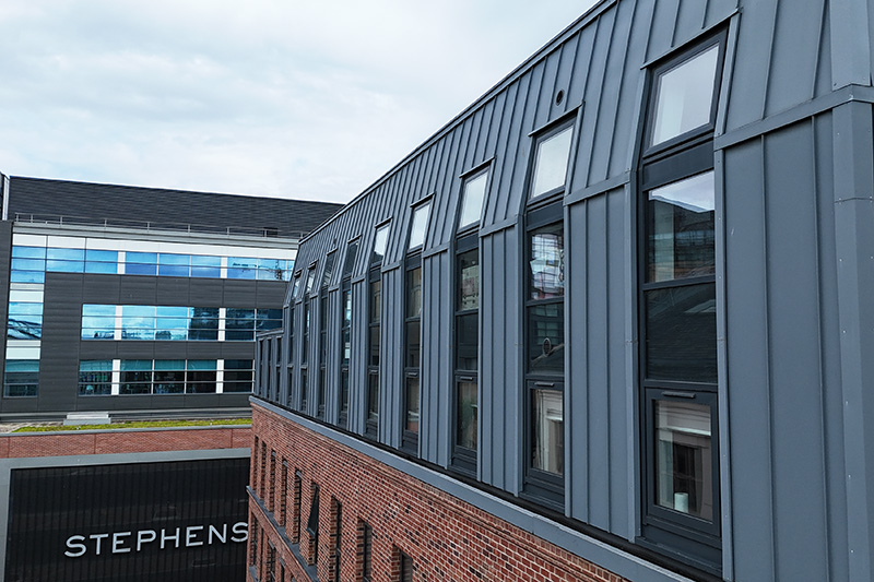 Commercial building cladding made of zinc standing seam sheets and installed by KingCraft roofing & cladding specialists Leeds, Yorkshire.