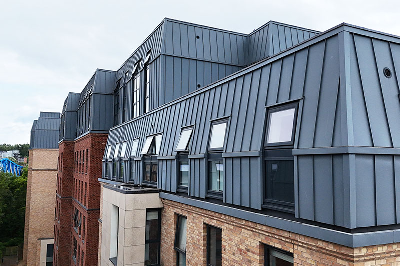 Roofing contractors near me from KingCraft roofing & cladding specialists Leeds, Yorkshire installing zinc wall cladding, standing seam system.