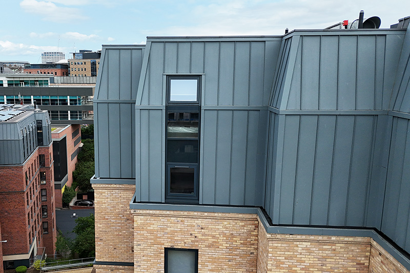 Commercial building with wall cladding made by Vieo, standing seam zinc panels installed by KingCraft roofing & cladding specialists Leeds, Yorkshire.