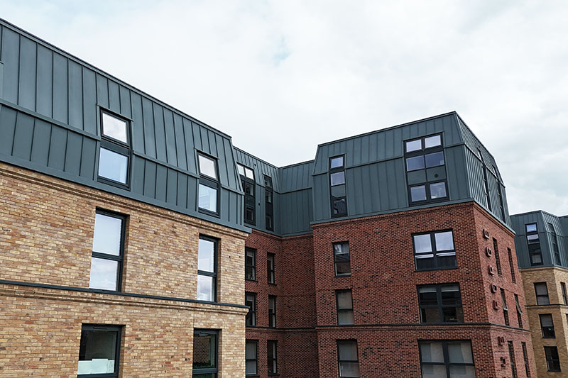 Wall cladding, standing seam system, zinc vieo cladding installed by KingCraft roofing & cladding specialists Leeds, Yorkshire.