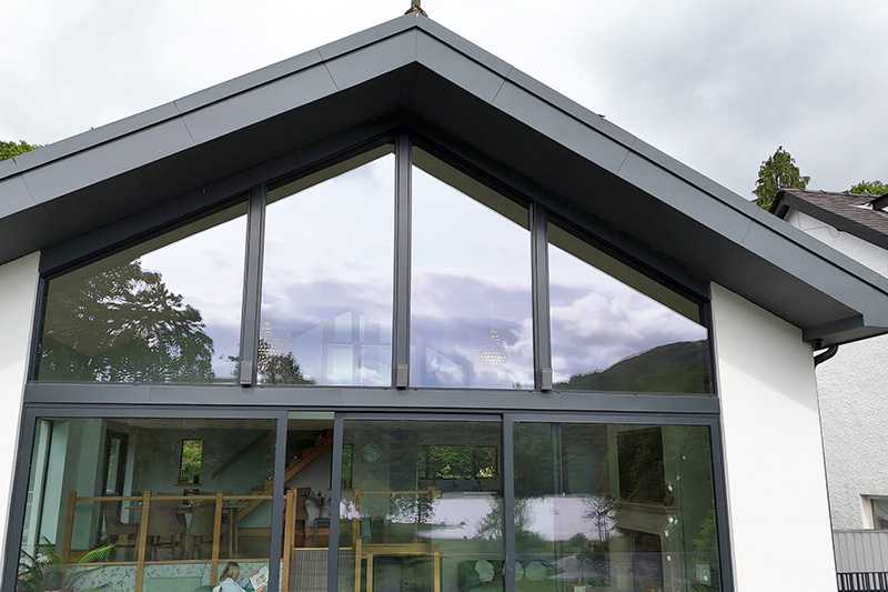 Prefa aluminium standing seam panels blended with slate roof finish by KingCraft Roofing & Cladding in Leeds, Yorkshire using hard metals.