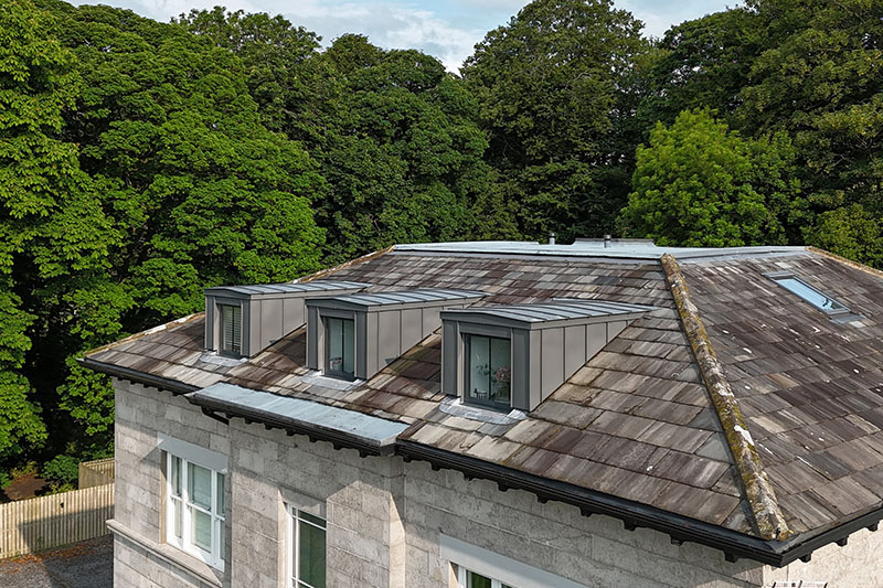 Precision standing seam wall cladding and slate roof installed on cold structure - KingCraft Leeds, roofing & cladding, Yorkshire.