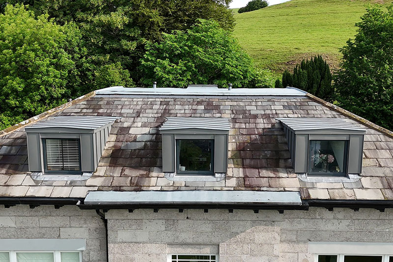 On-site fabricated zinc cladding and slate roof system by KingCraft - expert installers in Leeds, serving all Yorkshire.